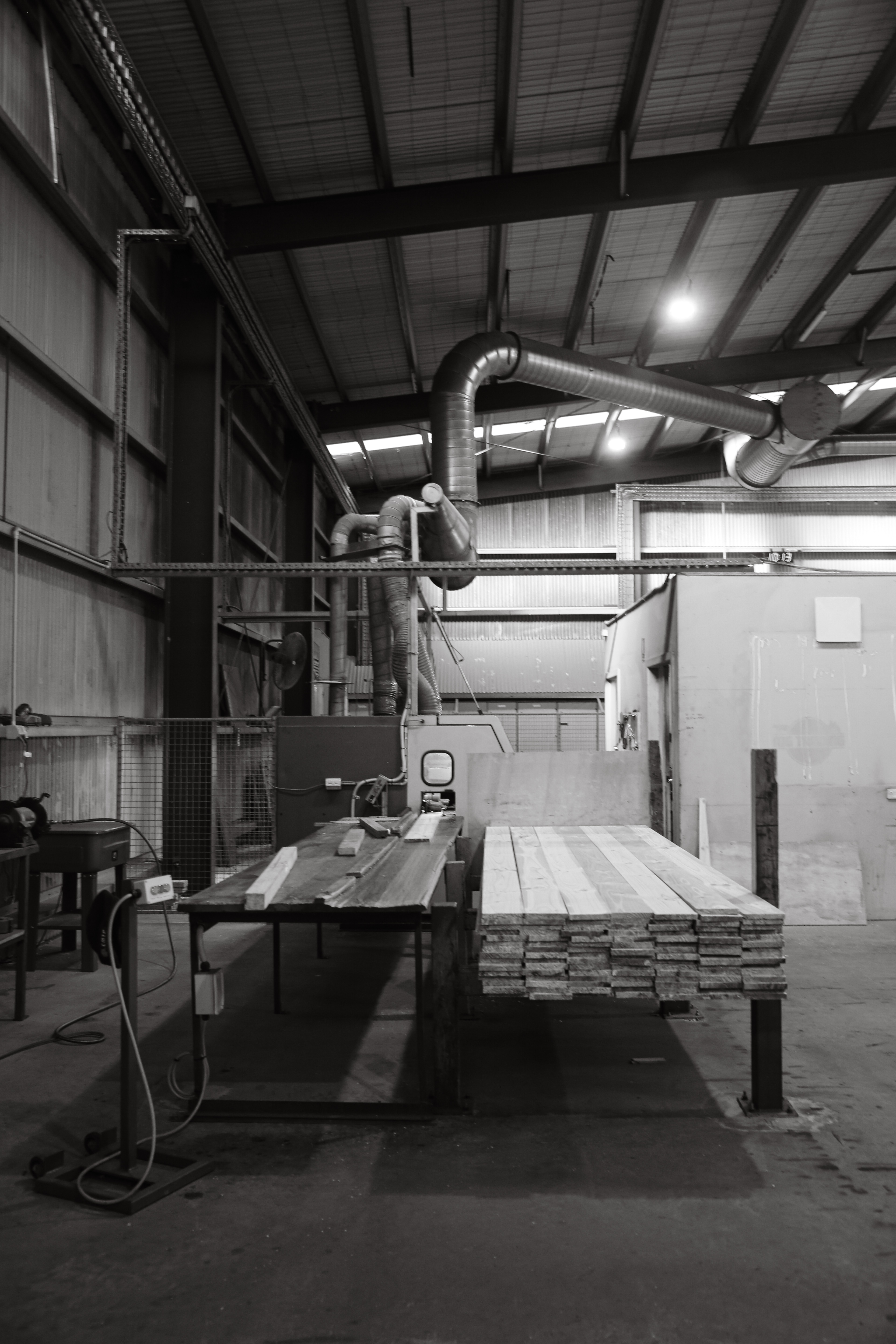 Timber planing and cutting machinery, black and white portrait