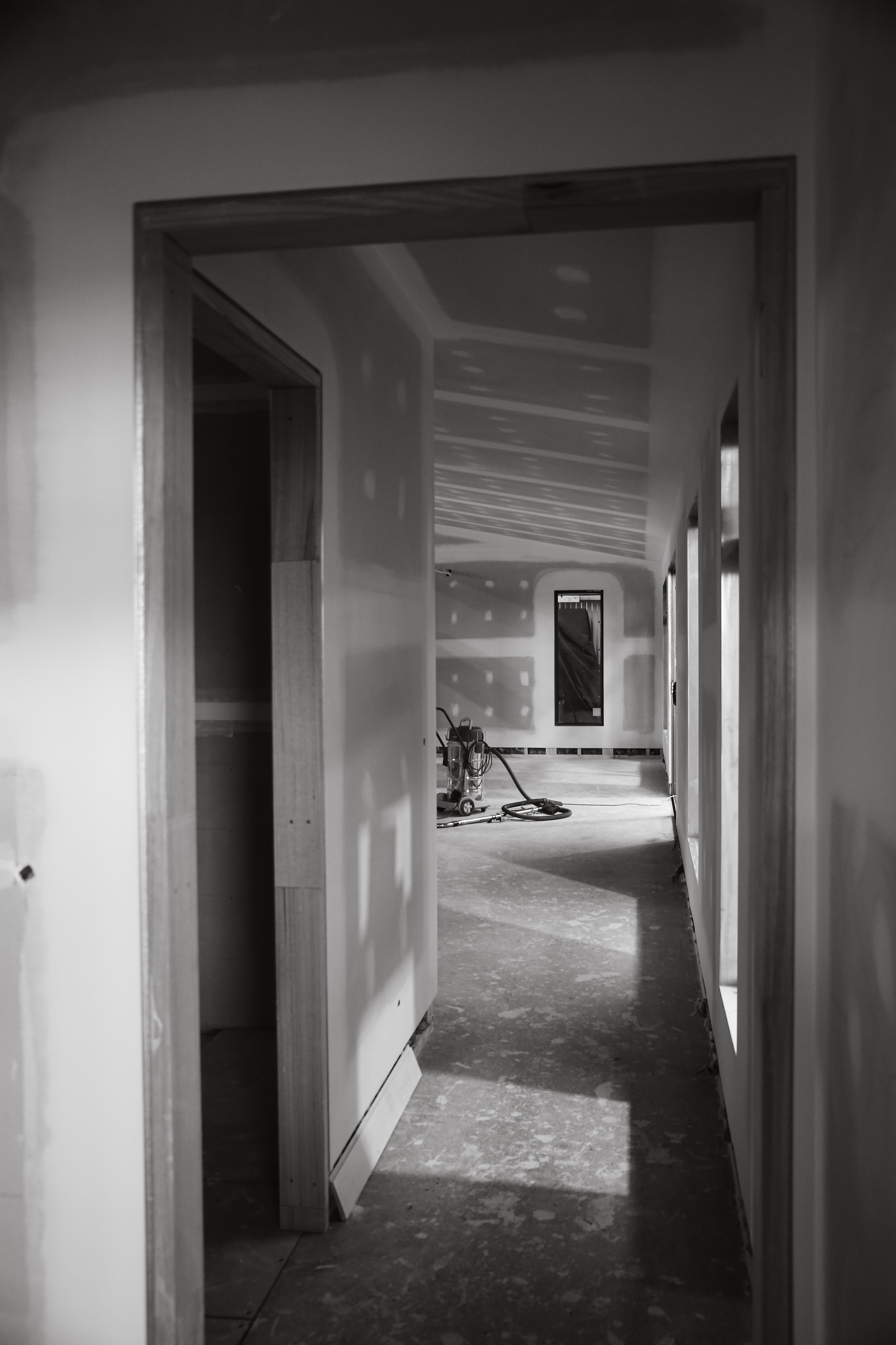 Interior hallway of a modular unit under construction, black and white portrait